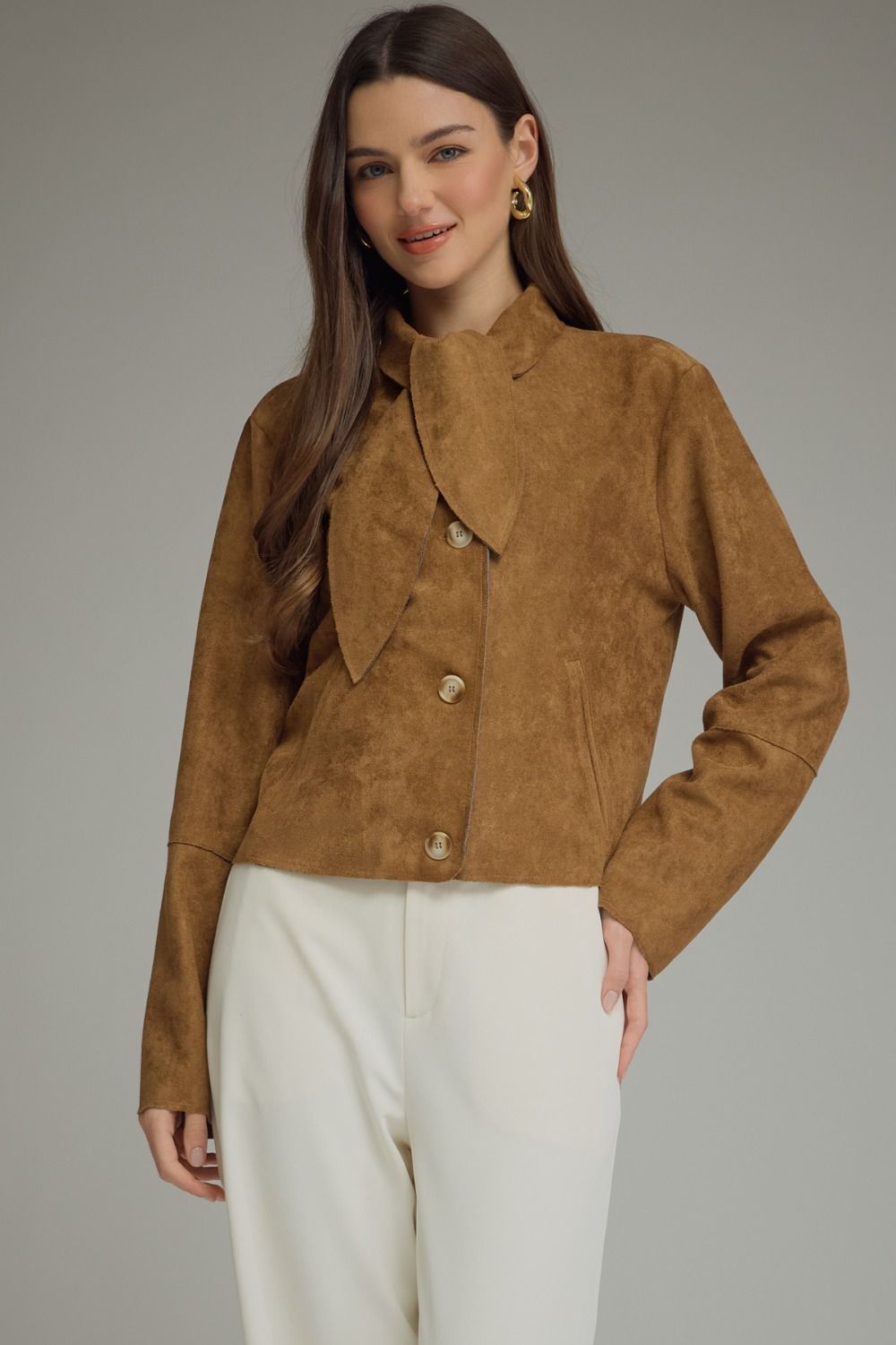A chic cropped jacket featuring a feminine self-tie neckline, button-front closure, and raw-edge hem for an effortlessly stylish finish.