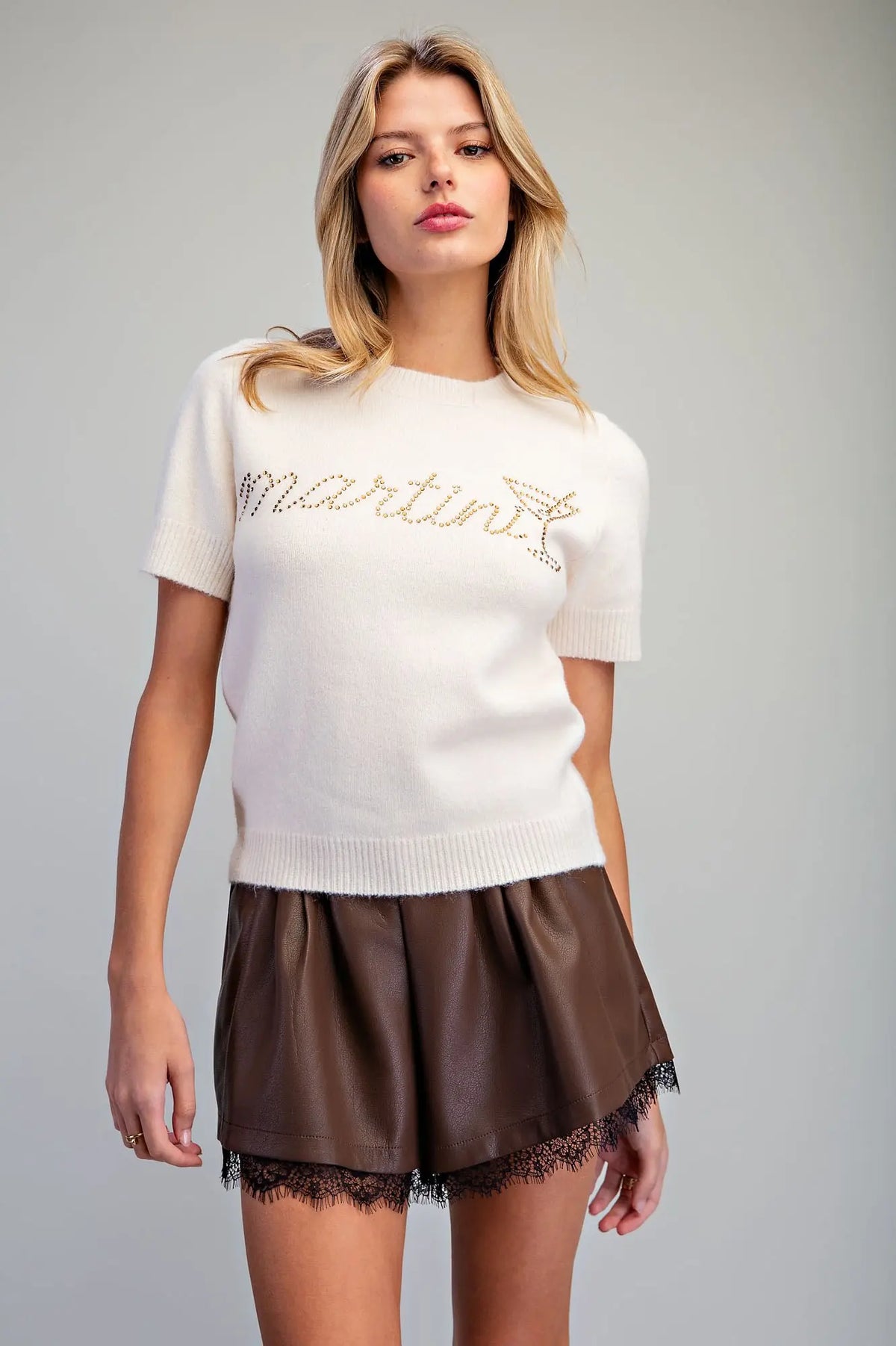 Raise a glass to effortless style with this ultra-soft knit sweater featuring sparkling "Martini" rhinestone lettering and a chic cocktail glass design.