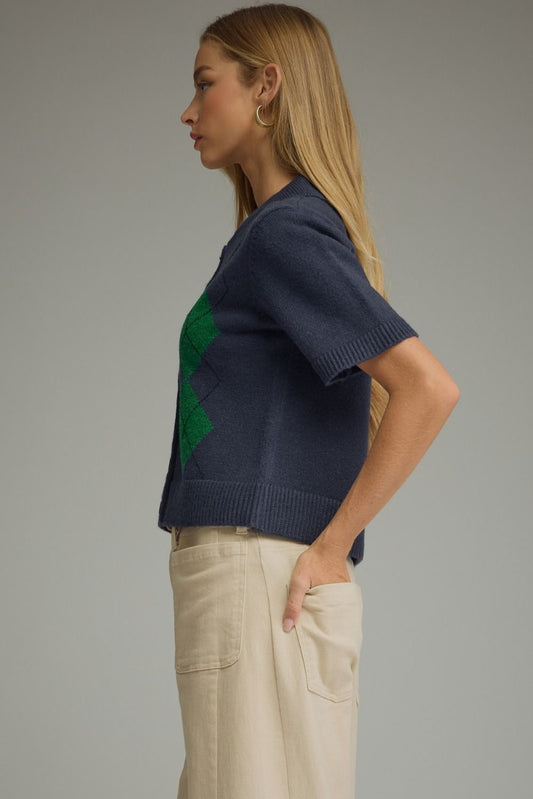 A lightweight argyle knit sweater featuring a classic collar, button-front closure, and ribbed trim for polished everyday layering.
