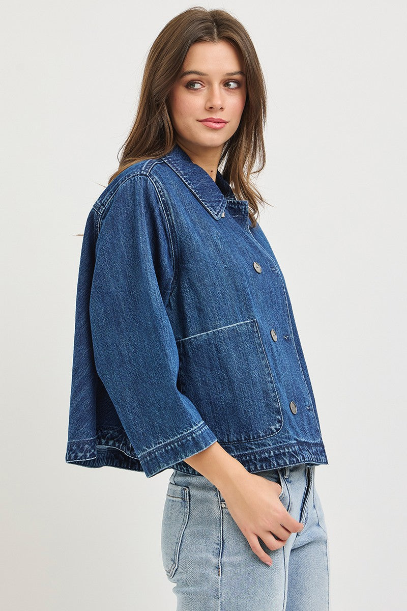 The Bernadette Flowy Cropped Denim Jacket gives classic denim a fresh feminine update with a wide, relaxed silhouette, button front, and voluminous sleeves.