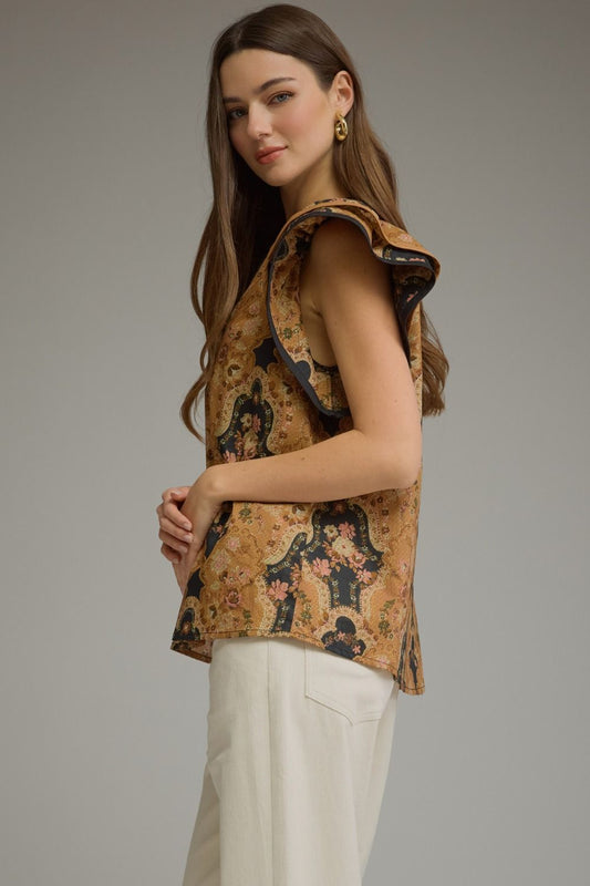 A feminine floral cotton top featuring romantic ruffle cap sleeves, contrast trim, and a flattering split neckline for effortless everyday elegance.