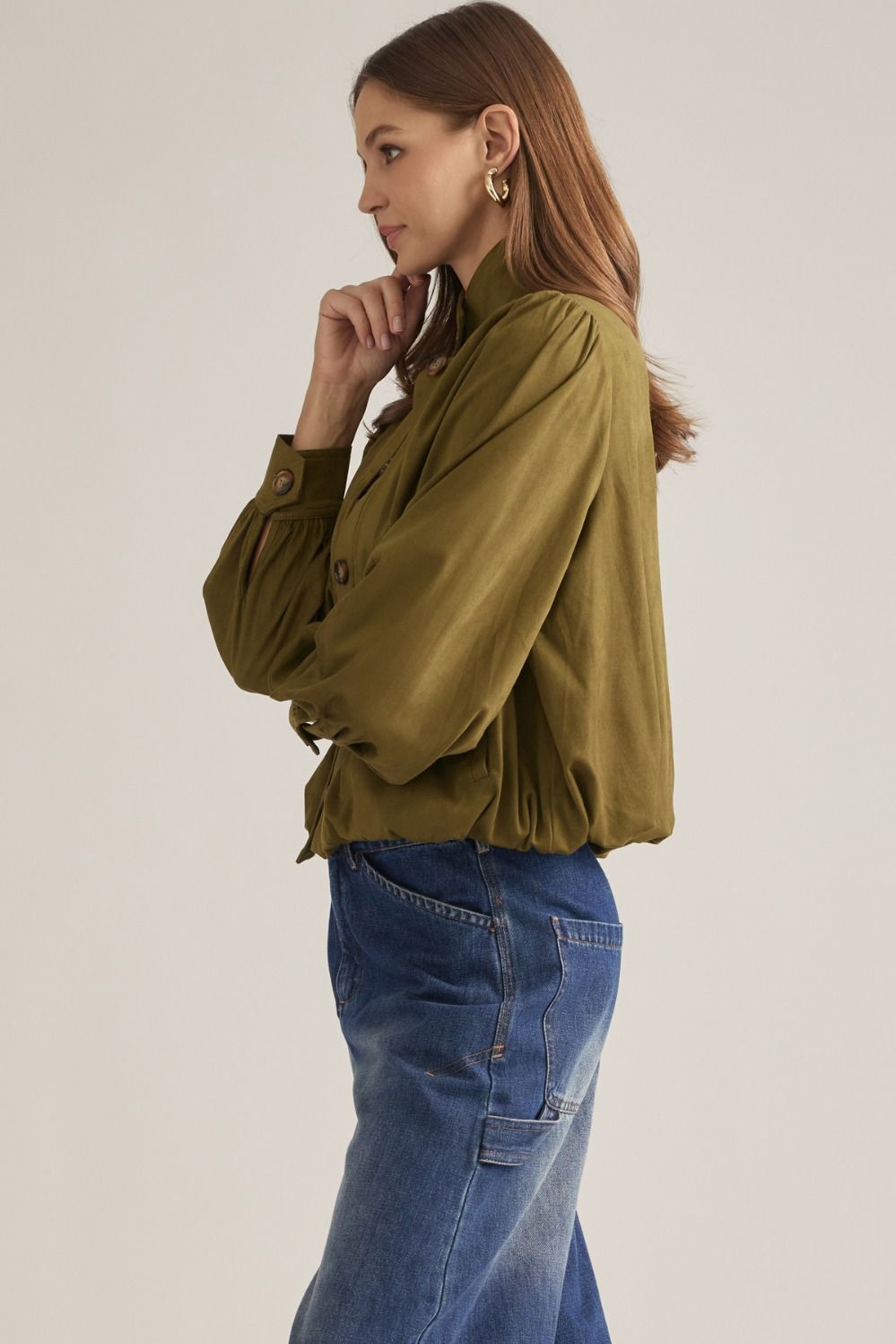 A polished long-sleeve jacket featuring a structured stand collar, gathered shoulder details, and a classic button front for effortless sophistication.

