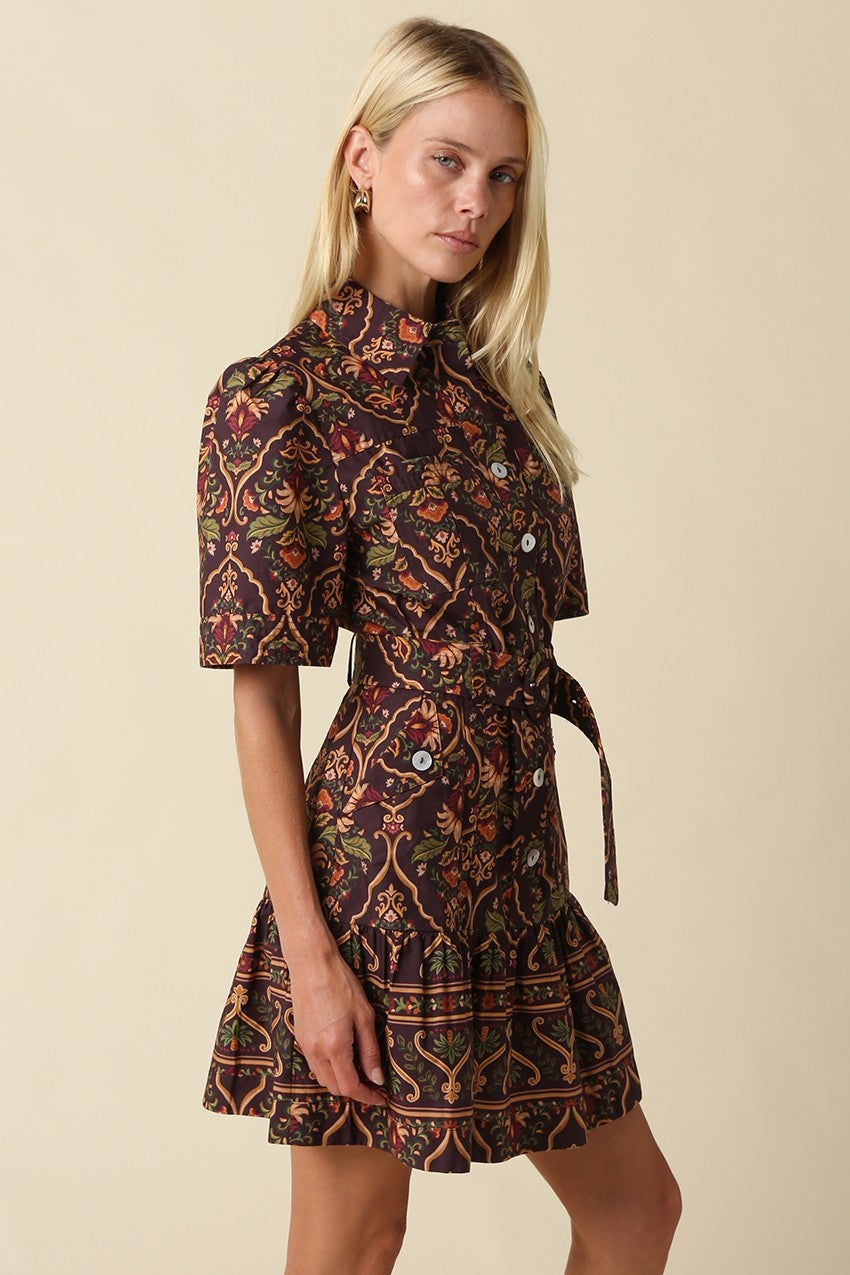 A romantic cotton paisley mini dress featuring a flattering fit-and-flare silhouette, puff sleeves, removable self-tie belt, and tiered ruffle hem.

