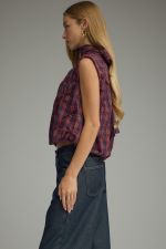 The Eleanor Plaid Top pairs a classic plaid pattern with feminine texture, a high neckline, and a playful bubble hem for a fresh, elevated look.