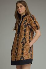 feminine printed mini dress featuring romantic puff sleeves, a contrast ruffle neckline, and lightweight comfort for effortless everyday elegance.
