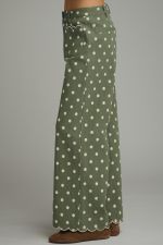 Playful polka dot wide-leg pants featuring scalloped embroidered trim and a polished button-front closure for a feminine, elevated look.
