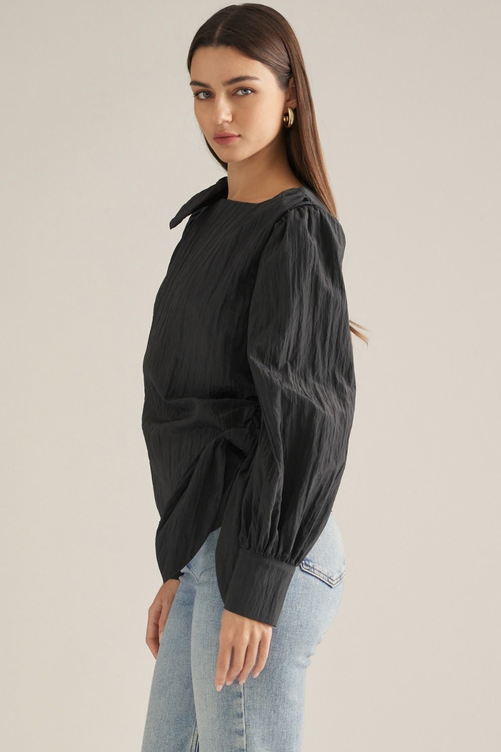 Elevate your wardrobe with this chic long-sleeve blouse featuring a straight neckline, feminine shoulder tie, and flattering side-wrap detail.

