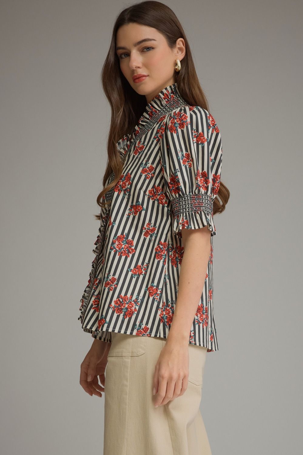The Beatrice Floral Stripe Blouse blends charming stripes and florals with romantic ruffle details for a feminine, effortlessly polished look.
