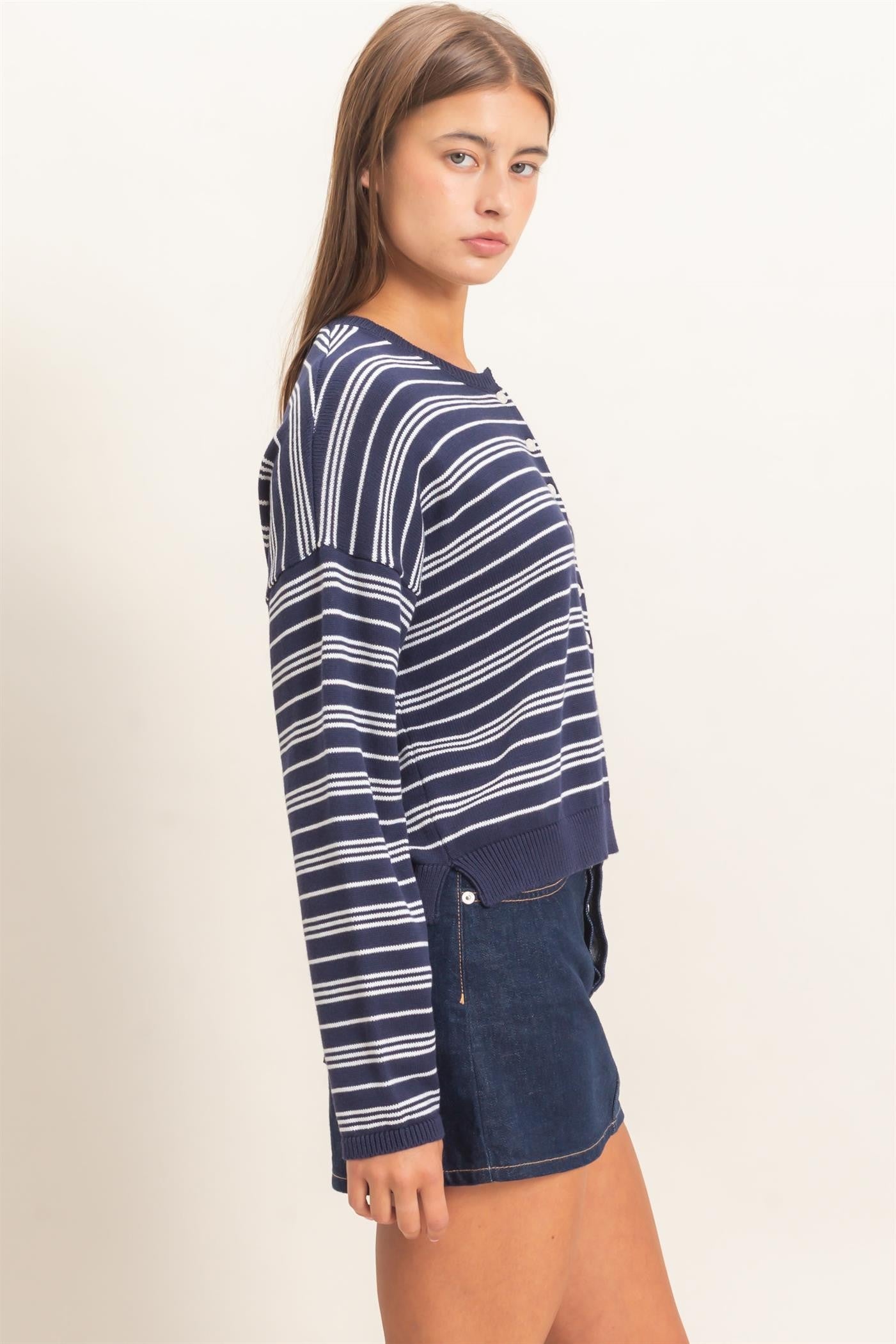 A classic striped ribbed sweater with a modern henley neckline and cozy long sleeves, perfect for effortless everyday style.

