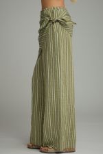 Elevate your everyday style with striped wide-leg pants featuring a chic wrap scarf waist, comfortable elastic waistband, and lightweight woven fabric.

