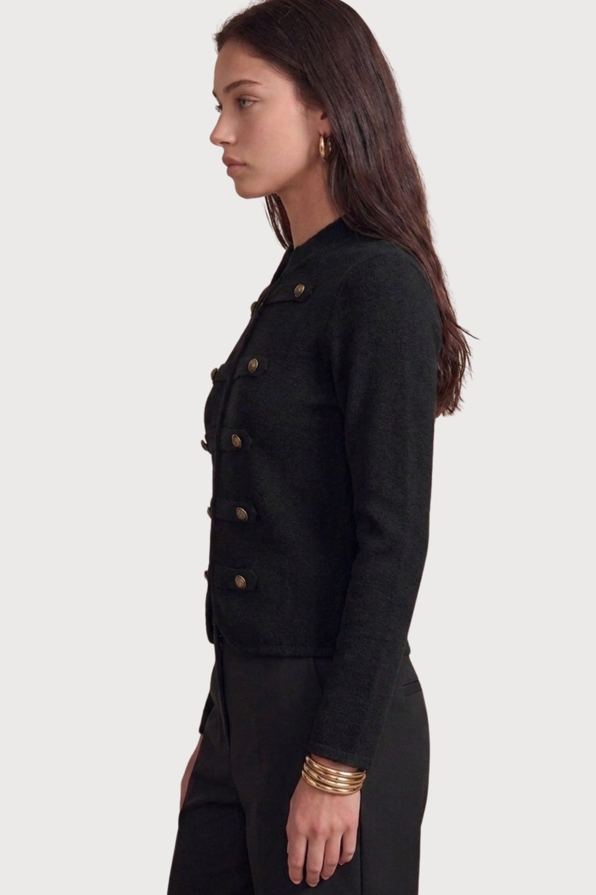 A polished military-inspired knit jacket featuring a structured silhouette, collarless crew neckline, and statement dome buttons for a timeless, tailored look.