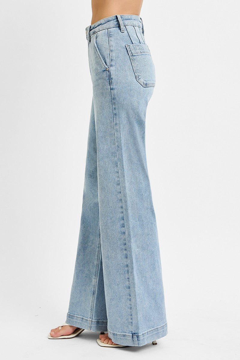 Classic denim meets modern style in these high-rise wide-leg jeans featuring flattering slanted front pockets and an effortlessly chic silhouette.