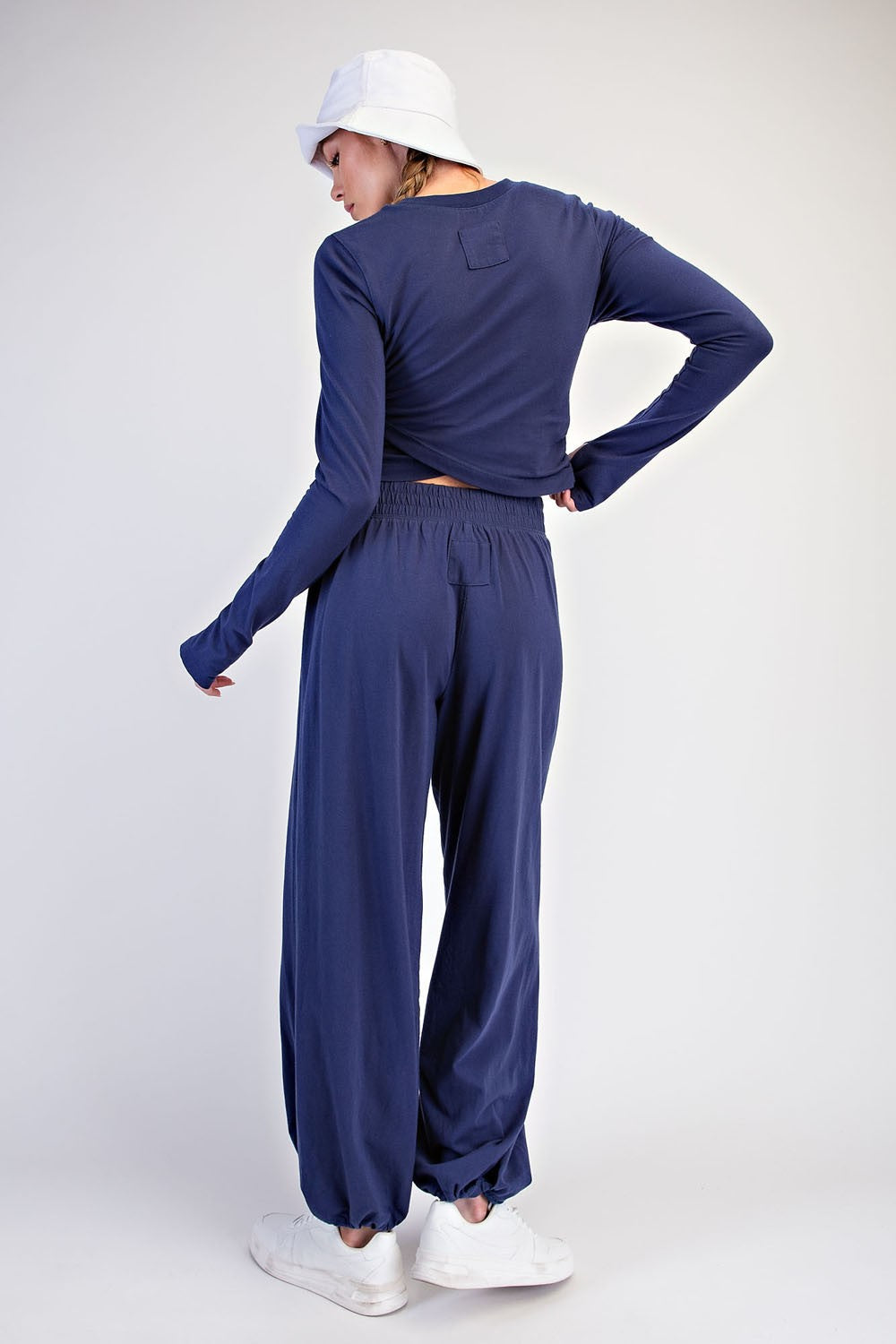 A soft, breathable cotton Lycra two-piece set featuring a cropped long sleeve top and relaxed ankle-length pants for effortless comfort from active days to downtime.


