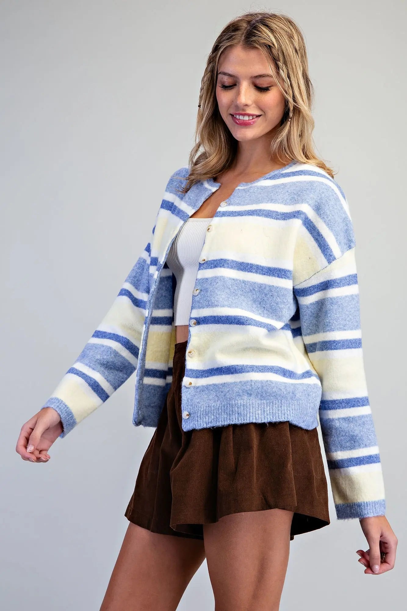 A timeless striped cardigan with a classic button-front design, relaxed dropped shoulders, and subtle ribbed trim for effortless everyday layering.
