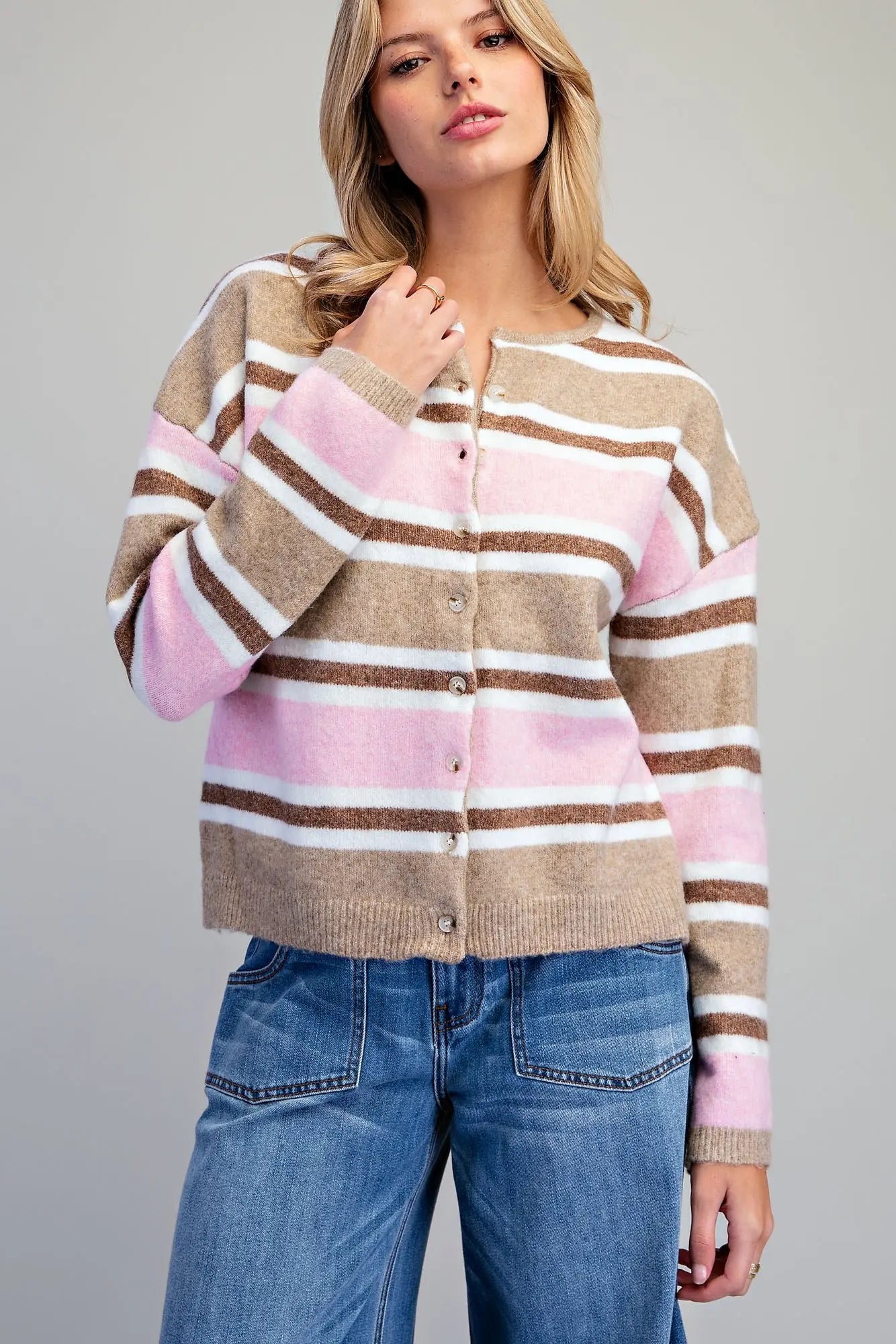 A timeless striped cardigan with a classic button-front design, relaxed dropped shoulders, and subtle ribbed trim for effortless everyday layering.
