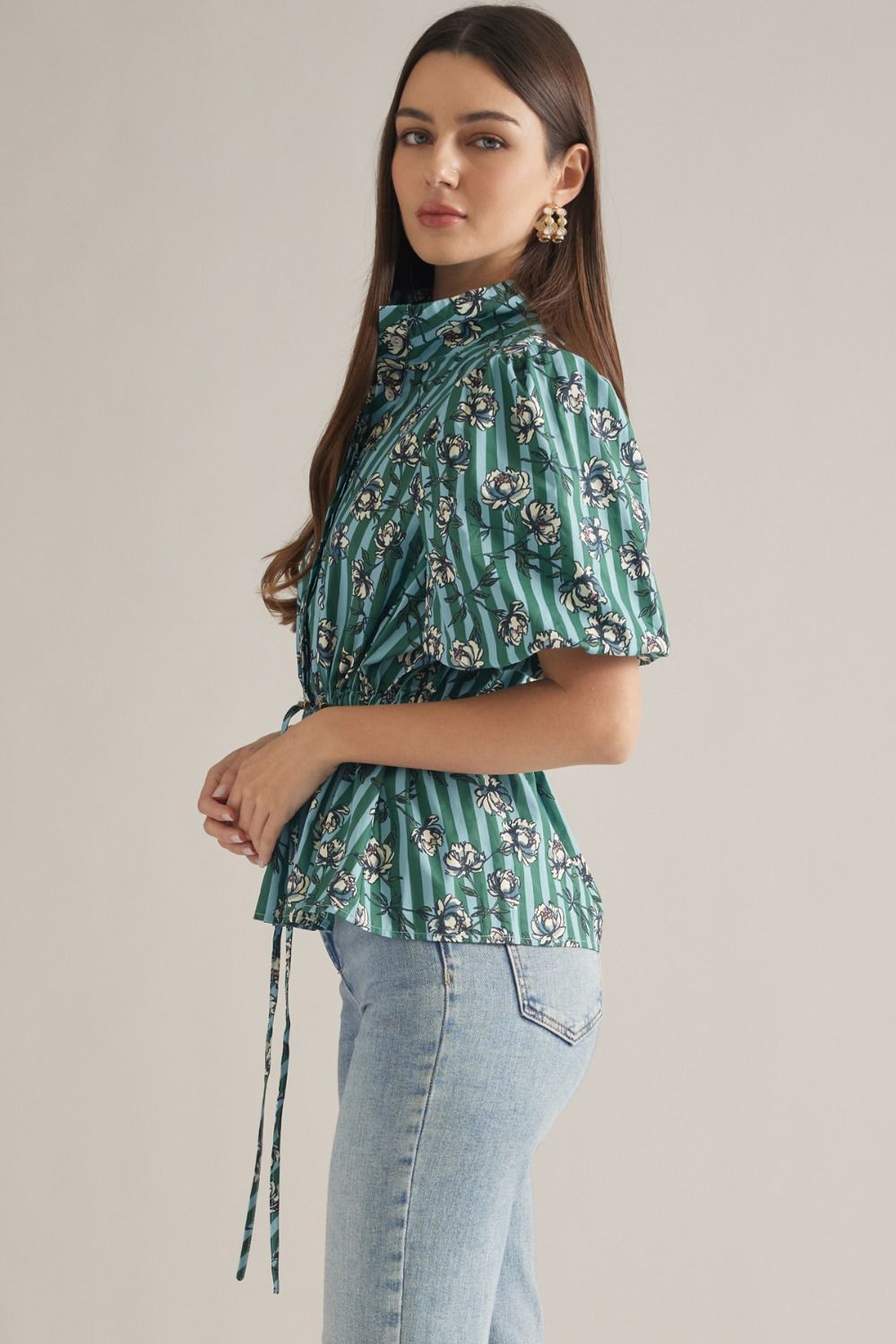 A charming stripe floral blouse featuring puff sleeves, a split neckline, and a flattering drawstring waist for effortless feminine style.