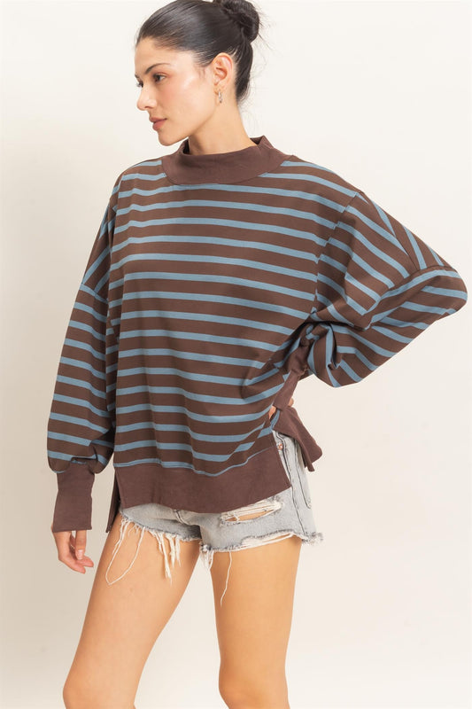 A relaxed striped sweatshirt featuring a cozy mock neck, ribbed cuffs, and a split hem for effortless everyday style.

