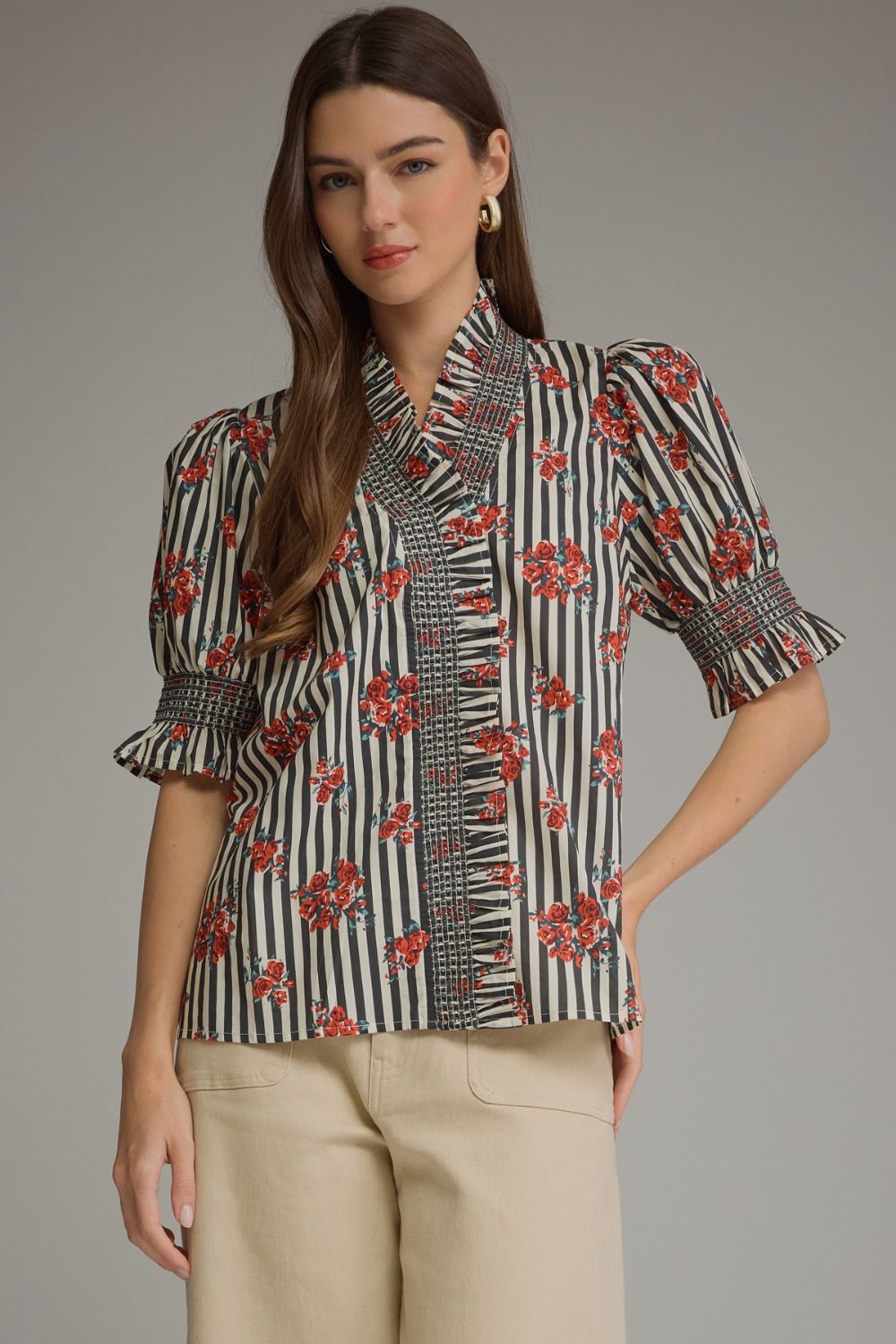 The Beatrice Floral Stripe Blouse blends charming stripes and florals with romantic ruffle details for a feminine, effortlessly polished look.
