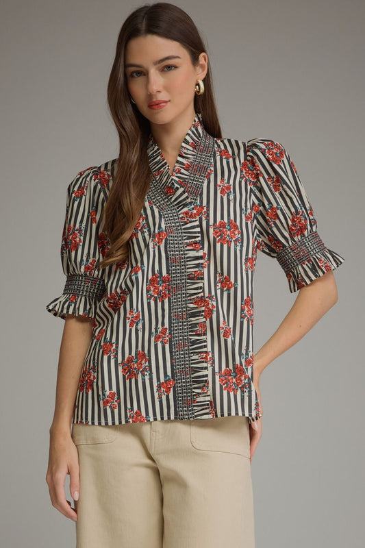 The Beatrice Floral Stripe Blouse blends charming stripes and florals with romantic ruffle details for a feminine, effortlessly polished look.

