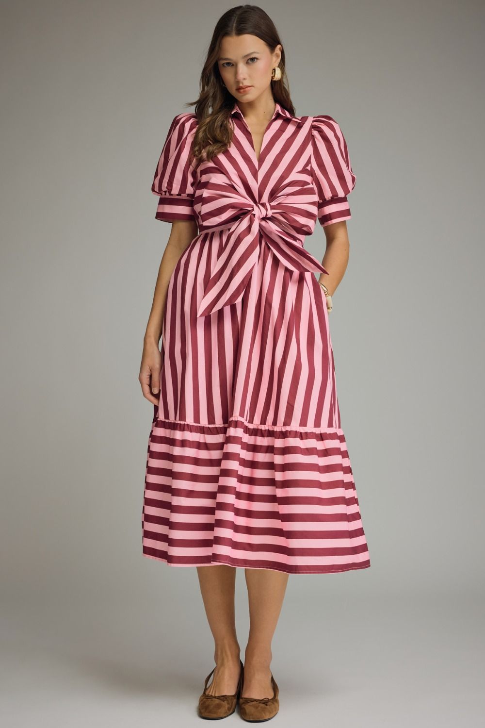 A timeless striped midi dress featuring puff sleeves, a self-tie front, and a collared neckline for effortlessly polished style.
