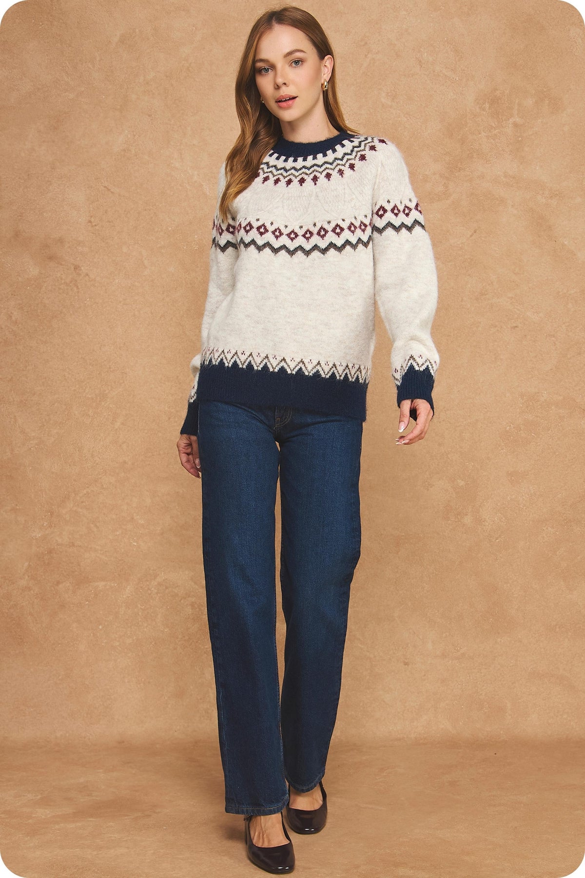 Stay cozy in vintage-inspired style with a soft Fair Isle sweater featuring a cream knit base, rich seasonal colors, and contrasting navy ribbed trim.


