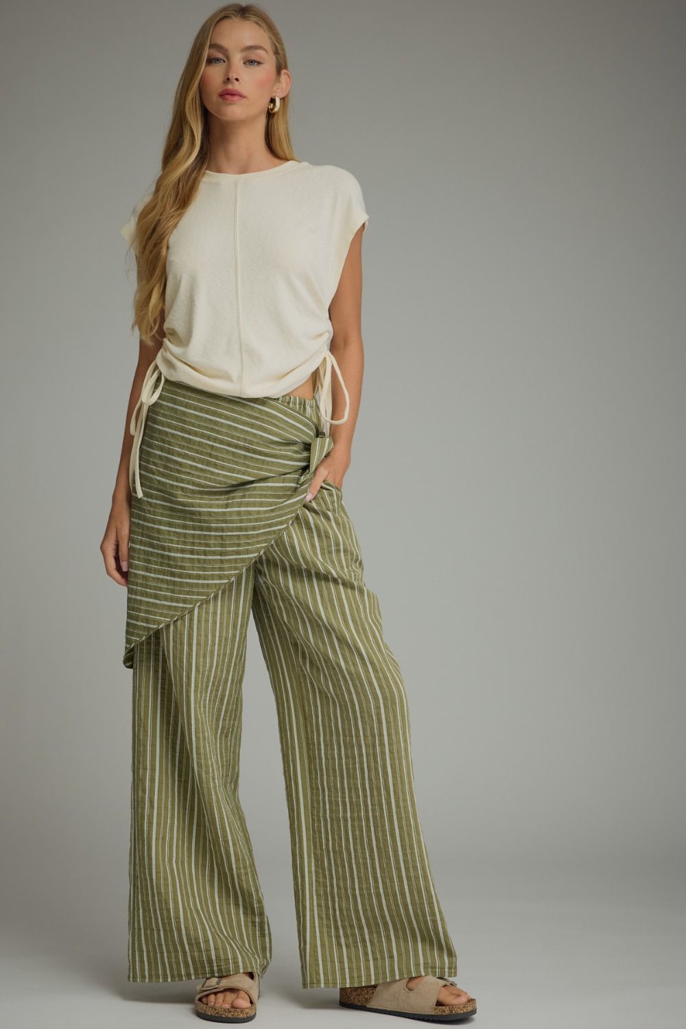 Elevate your everyday style with striped wide-leg pants featuring a chic wrap scarf waist, comfortable elastic waistband, and lightweight woven fabric.

