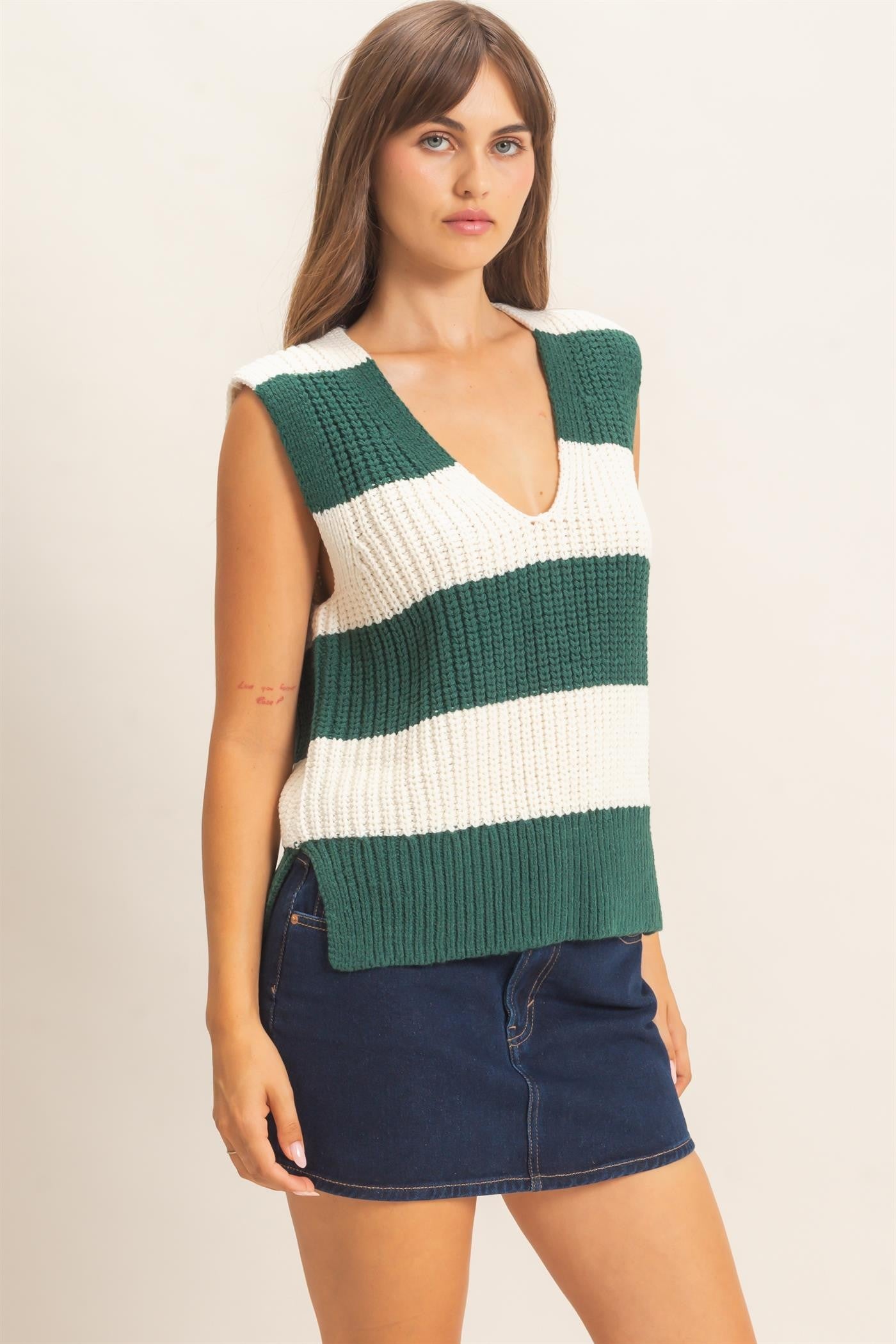 A bold striped sweater vest with a deep V-neckline and relaxed fit, perfect for polished layering from the office to after-hours.
