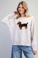 A playful holiday-inspired knit sweater featuring an adorable cowboy dog graphic, classic crew neckline, and cozy relaxed fit.