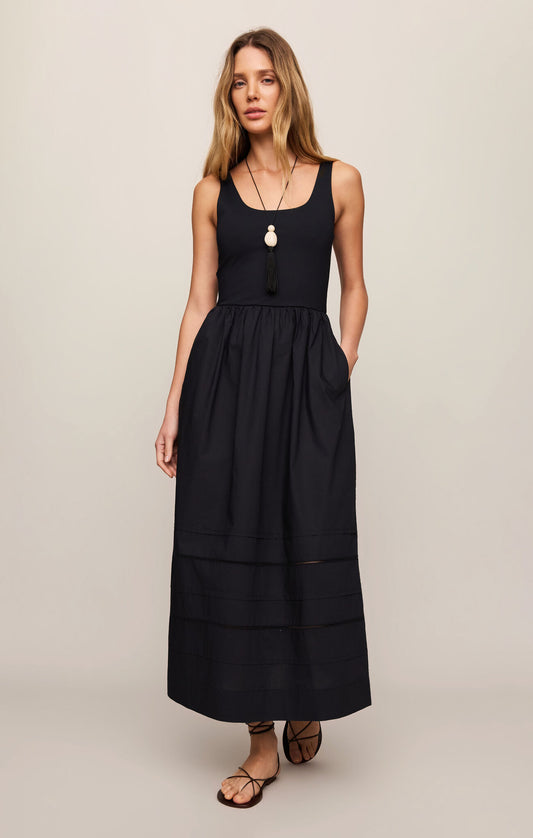 A timeless cotton poplin midi dress featuring a flattering scoop neckline, wide straps, and effortless comfort with a polished everyday silhouette.