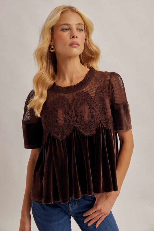 A romantic velvet contrast top featuring delicate scalloped mesh and crochet lace details for a feminine, elevated look.
