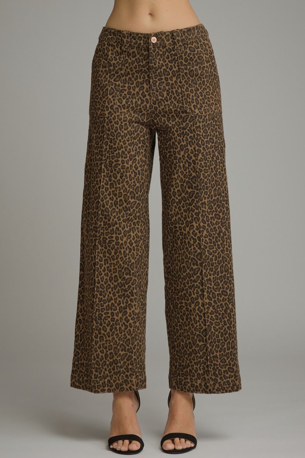 Bold leopard print meets an effortlessly polished silhouette in these lightweight wide-leg pants featuring practical pockets and a classic zip-fly button closure.