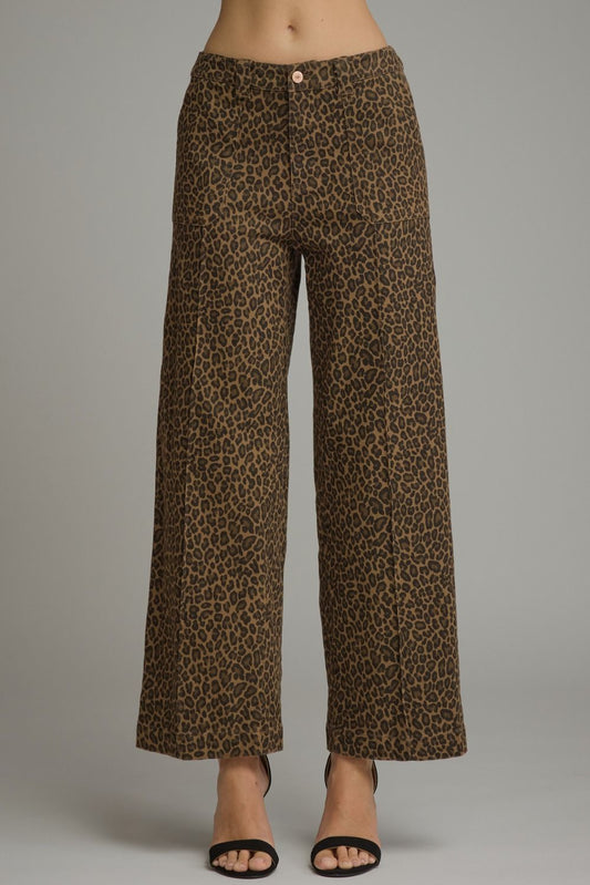 Bold leopard print meets an effortlessly polished silhouette in these lightweight wide-leg pants featuring practical pockets and a classic zip-fly button closure.