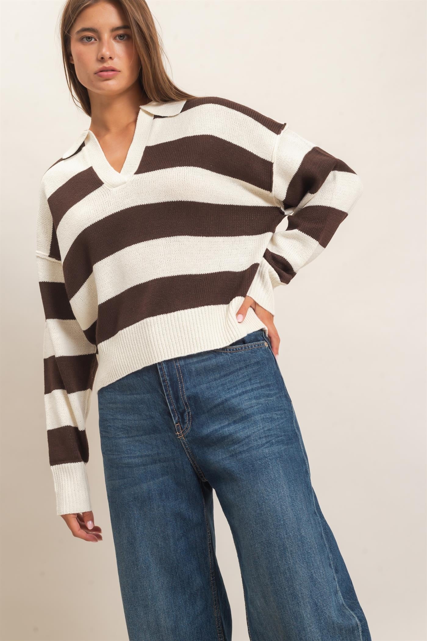 A relaxed striped sweater with a statement wide collar and ribbed cuffs that brings effortless polish to everyday casual style.